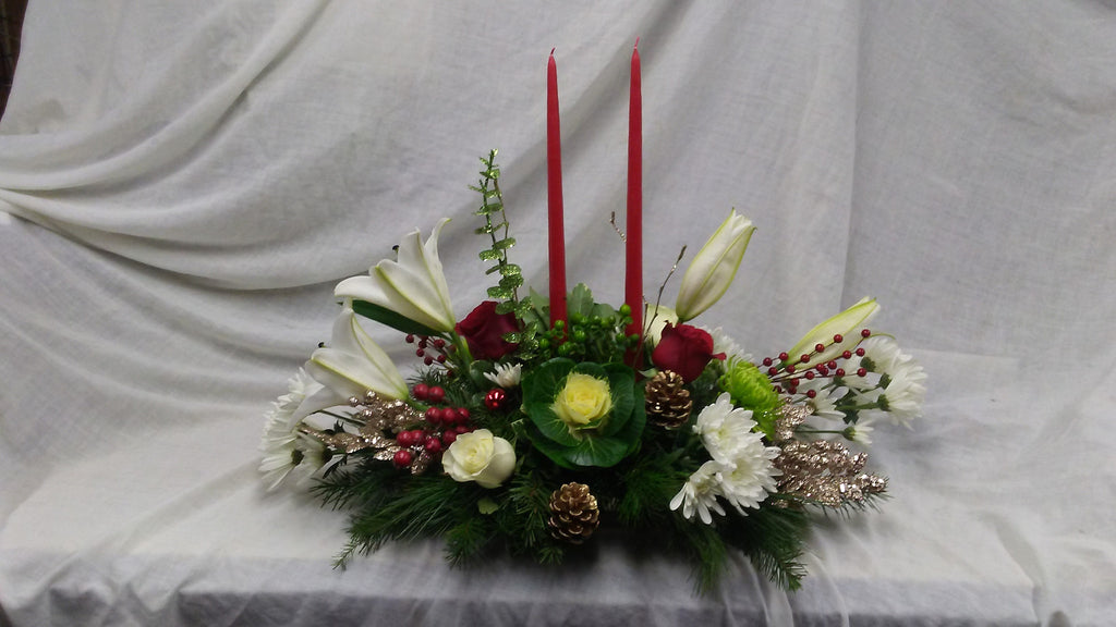 extoic winter arrangenment with red candles